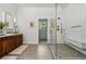Modern bathroom with a large shower, sleek vanity, and contemporary design elements at 6388 Donner Cir, Parker, CO 80134
