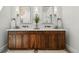 Well-lit bathroom featuring a double vanity with wood cabinets, modern mirrors, and stylish decor at 6388 Donner Cir, Parker, CO 80134