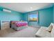 Bright bedroom with an AC unit, a window view, and neutral carpet at 6388 Donner Cir, Parker, CO 80134