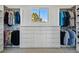 Walk-in closet with custom storage solutions and a window offering natural light and a view of greenery at 6388 Donner Cir, Parker, CO 80134