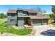 Beautiful two-story home with a front lawn, a wooden deck and a two-car garage at 6388 Donner Cir, Parker, CO 80134
