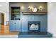 Cozy fireplace with built-in shelving and sleek design at 6388 Donner Cir, Parker, CO 80134