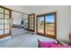 Open living room with a walkout to a wooden deck showing gorgeous outdoor scenery at 6388 Donner Cir, Parker, CO 80134