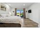 Bedroom boasts sliding glass doors to yard and deck with views of the expansive backyard at 6388 Donner Cir, Parker, CO 80134