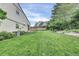 Large backyard with a well-maintained lawn and partial fence, ideal for outdoor activities at 4483 S Eagle Cir, Aurora, CO 80015