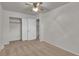 Neutral bedroom with ceiling fan, closet, and a cozy, carpeted floor at 4483 S Eagle Cir, Aurora, CO 80015