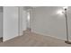 Bedroom featuring carpeted floors, closet, and door leading to another room at 4483 S Eagle Cir, Aurora, CO 80015