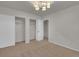 Carpeted bedroom offers closet space and a modern light fixture for comfort at 4483 S Eagle Cir, Aurora, CO 80015