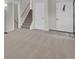 Entryway featuring carpet, a staircase and an exterior door adorned with a wreath at 4483 S Eagle Cir, Aurora, CO 80015