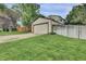 Exterior view of the house showcasing the lush green lawn and a two-car garage at 4483 S Eagle Cir, Aurora, CO 80015