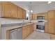 Functional kitchen with stainless steel appliances and light wood cabinetry at 4483 S Eagle Cir, Aurora, CO 80015