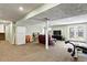 Large finished basement space with a TV, exercise equipment and walkout at 6866 W David Ave, Littleton, CO 80128