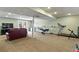 Spacious basement featuring a seating area and exercise equipment at 6866 W David Ave, Littleton, CO 80128