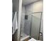 Updated bathroom featuring a tiled walk-in shower and modern fixtures at 6866 W David Ave, Littleton, CO 80128