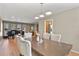 Open dining area adjacent to living room and kitchen with light neutral colors at 6866 W David Ave, Littleton, CO 80128