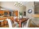 Dining room with modern lighting and decor, open to kitchen at 6866 W David Ave, Littleton, CO 80128