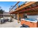 Backyard patio with outdoor seating area, fire pit, and a relaxing hot tub at 6866 W David Ave, Littleton, CO 80128