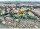 Overhead aerial view showing the property, surrounding trees, meadow, and auxiliary structures at 8700 Flintwood Rd, Parker, CO 80138