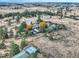 High aerial view of the property amidst a scenic landscape with trees and meadows at 8700 Flintwood Rd, Parker, CO 80138