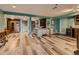 Finished basement featuring stylish wood flooring, a wet bar, and ample space for entertaining and relaxation at 8700 Flintwood Rd, Parker, CO 80138