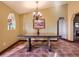 Inviting dining room with a large wooden table, tile flooring, and elegant chandelier at 8700 Flintwood Rd, Parker, CO 80138