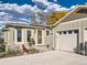 Charming home exterior featuring an attached garage and inviting front entrance at 8700 Flintwood Rd, Parker, CO 80138