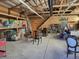 Interior view of a large outbuilding with high ceilings and visible framing at 8700 Flintwood Rd, Parker, CO 80138