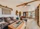 Cozy living room featuring hardwood floors, beamed ceiling, and decorative accents at 8700 Flintwood Rd, Parker, CO 80138