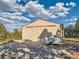 Large outbuilding with sliding door, concrete pad and trailer parked outside at 8700 Flintwood Rd, Parker, CO 80138