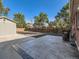 Spacious backyard featuring a concrete patio, privacy fence, and detached garage at 1731 Uinta St, Denver, CO 80220