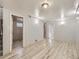 Large finished basement offering extra living space with plank flooring and neutral paint at 1731 Uinta St, Denver, CO 80220