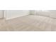 Bright bedroom featuring neutral carpet, white walls, and large windows for ample natural light at 6068 Hourglass Dr, Brighton, CO 80601