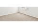 Bright bedroom featuring a window with blinds, carpeted floors and neutral paint at 6068 Hourglass Dr, Brighton, CO 80601