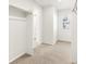 This is a bedroom with carpeted floors, a window with blinds, and a closet at 6068 Hourglass Dr, Brighton, CO 80601