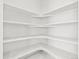 Interior shot of walk-in pantry with all white walls and shelving at 6068 Hourglass Dr, Brighton, CO 80601
