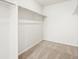 Spacious walk-in closet featuring carpeted floors, and shelving for optimal organization at 6068 Hourglass Dr, Brighton, CO 80601