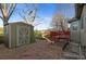 A shed and garden sit in the backyard, which has a deck at 12734 Eudora Dr, Thornton, CO 80241