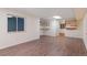 View of the basement with wood grain flooring, a window, and shelving at 12734 Eudora Dr, Thornton, CO 80241