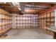 Unfinished basement space with exposed wood beams, shelving, and concrete floors at 12734 Eudora Dr, Thornton, CO 80241