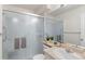 Bathroom featuring a glass-enclosed shower, neutral countertop, and modern fixtures at 12734 Eudora Dr, Thornton, CO 80241