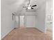 Bright bedroom features a ceiling fan, neutral carpet, and large closet for ample storage at 12734 Eudora Dr, Thornton, CO 80241