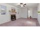 Living room with fireplace, lots of light, and ample space at 12734 Eudora Dr, Thornton, CO 80241
