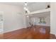 Light-filled living room features sleek hardwood floors and a neutral palette at 12734 Eudora Dr, Thornton, CO 80241