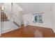 Bright and airy living room features hardwood floors, white walls, and a cozy window seat at 12734 Eudora Dr, Thornton, CO 80241