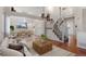 Open-concept living and dining area with hardwood floors, neutral decor, and ample natural light at 12734 Eudora Dr, Thornton, CO 80241