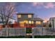 Charming home featuring a well-maintained backyard with a red wood deck and secure fence at 12734 Eudora Dr, Thornton, CO 80241