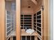 Inviting cedar sauna room featuring a bench and traditional wood paneling for relaxation at 18496 Pixie Park Rd, Monument, CO 80132