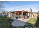 A beautiful backyard with a pergola-covered patio and a hot tub at 13215 Peacock Dr, Lone Tree, CO 80124