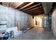 Unfinished basement with exposed rafters and concrete walls at 13215 Peacock Dr, Lone Tree, CO 80124