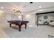 Finished basement featuring a pool table, neutral colors, and a carpeted floor at 13215 Peacock Dr, Lone Tree, CO 80124